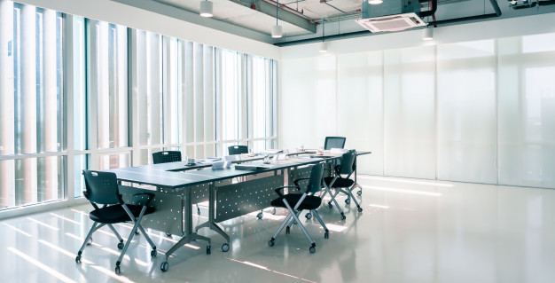 modern-interior-meeting-room-marketing-office-with-evening-sunset-empty-large-loft-style-conference-space-with-chairs-tables-furniture-clean-glass-windows-44651-340.jpg